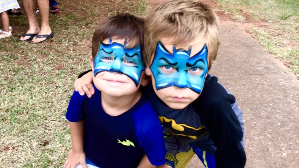 Two boys posing for a picture.