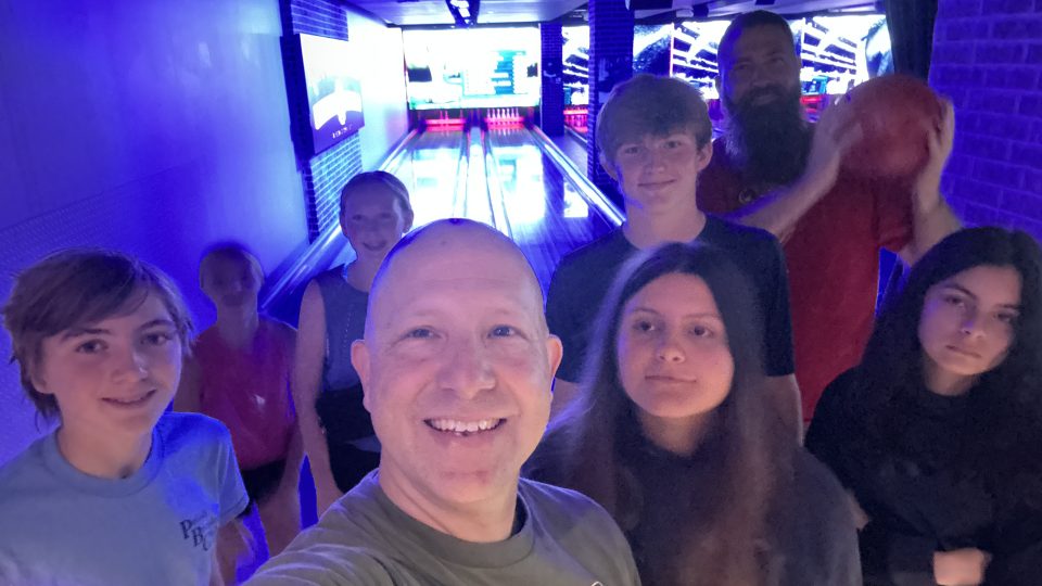 A group of people posing for a selfie